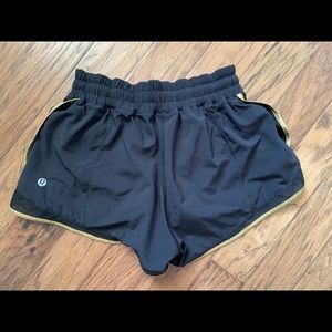 Lulu lemon shorts with a gold trim